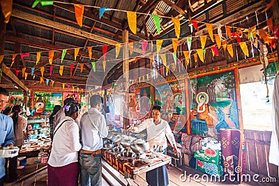 Cambodian Buddhist people to offer food to the monks at the temp Editorial Stock Photo